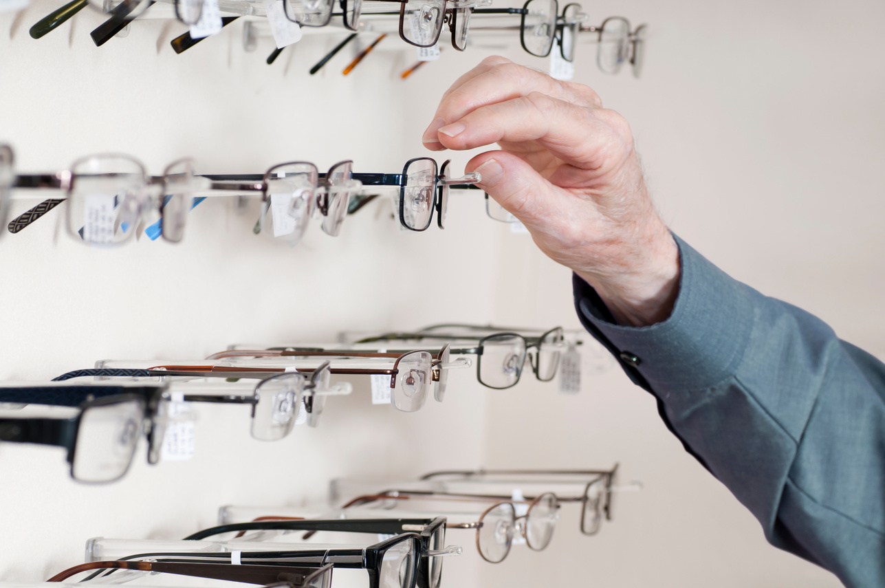 Man Selecting New Eyeglass Frames